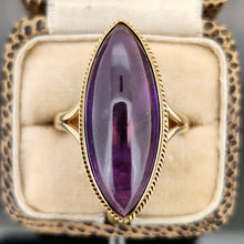 Load image into Gallery viewer, A yellow gold navette shaped cabochon cut amethyst solitaire ring, in a ring box
