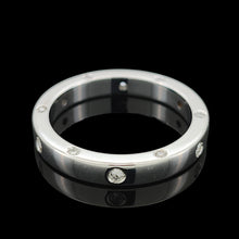 Load image into Gallery viewer, A round diamond set wedding band in white gold, on a black background
