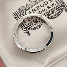 Load image into Gallery viewer, A round diamond set wedding band in white gold, in an antique box
