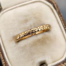 Load image into Gallery viewer, A yellow gold floral patterned wedding band ring, in an antique ring box
