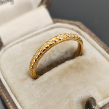 Load image into Gallery viewer, A yellow gold floral patterned wedding band ring, in an antique ring box
