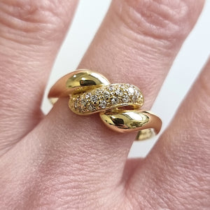 18ct Yellow Gold Brilliant Cut Diamond Twist Ring modelled
