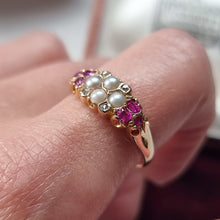 Load image into Gallery viewer, Gold ring with pearls, diamonds and rubies on a finger
