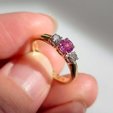 Load image into Gallery viewer, Vintage 18ct Gold Pink Sapphire and Diamond Three Stone Ring in hand
