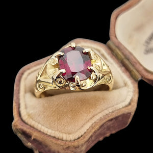 Antique 15ct Yellow Gold Garnet Solitaire Dress Ring in an antique ring box, on a black background 