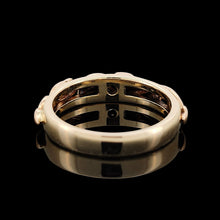 Load image into Gallery viewer, A yellow gold leaf motif band ring, on a black background
