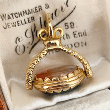 Load image into Gallery viewer, An oval spinner fob pendant in yellow gold with agate and bloodstone, in an antique box
