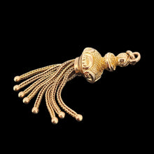 Load image into Gallery viewer, A yellow gold tassel pendant with engraved detailing
