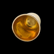 Load image into Gallery viewer, A yellow gold thimble, on a black background
