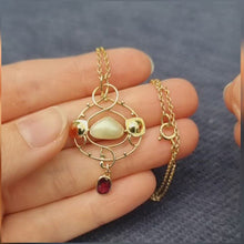 Load and play video in Gallery viewer, Art Nouveau 9ct Gold Garnet &amp; Pearl Pendant Necklace
