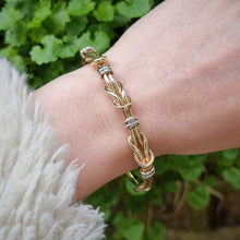 Load image into Gallery viewer, 9ct Yellow &amp; White Gold Knot Bangle modelled

