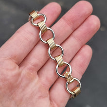 Load image into Gallery viewer, Vintage 9ct Yellow &amp; White Gold Circle Link Bracelet in hand
