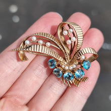 Load image into Gallery viewer, Vintage 9ct Gold Blue Zircon &amp; Pearl Bouquet Brooch in hand
