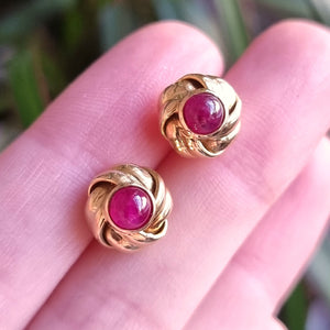 Vintage 18ct Gold Cabochon Ruby Knot Stud Earrings in hand