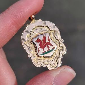 Art Deco 9ct Gold Welsh Dragon Enamel Fob Medal in hand