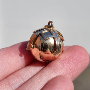 9ct Gold & Silver Masonic Ball Charm Pendant in hand