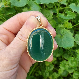 Large Vintage 9ct Gold Chalcedony Agate Pendant in hand