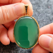 Load image into Gallery viewer, Large Vintage 9ct Gold Chalcedony Agate Pendant in hand
