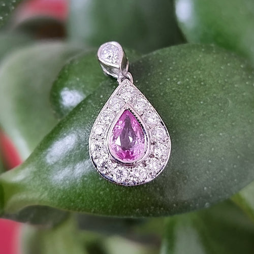 Vintage 18ct White Gold Pink Sapphire & Diamond Pendant on plant