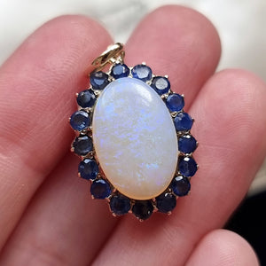 Vintage 9ct Gold Opal & Sapphire Cluster Pendant in hand