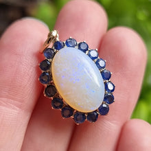 Load image into Gallery viewer, Vintage 9ct Gold Opal &amp; Sapphire Cluster Pendant in hand
