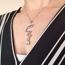Load image into Gallery viewer, 18ct White Gold Pearl and Diamond Twist Pendant with Chain modelled
