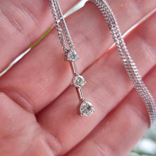 Load image into Gallery viewer, 18ct White Gold Three Stone Diamond Pendant, 0.36ct in hand
