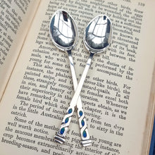 Load image into Gallery viewer, Liberty &amp; Co. Vintage Pair of Sterling Silver Teaspoons, Birmingham 1939 on book
