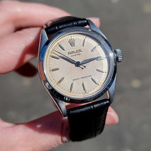 Load image into Gallery viewer, Rolex Oyster Vintage Stainless Steel Manual Wind, Circa 1954 in hand
